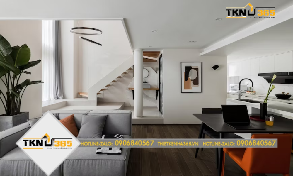 Phòng khách sử dụng gam xám, cam, đen để tạo điểm nhấn và sự tươi mới