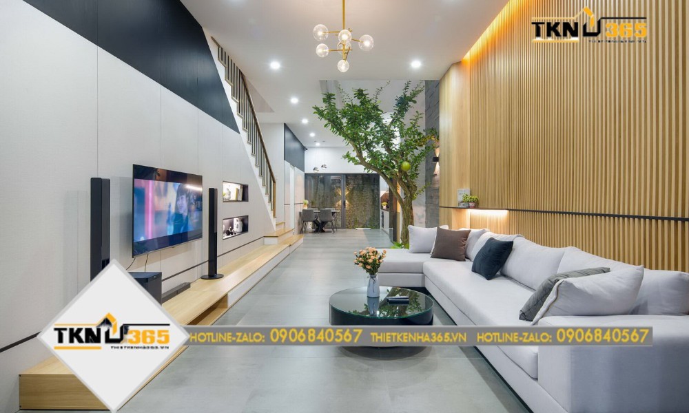 Không gian tầng 1 được thiết kế thông suốt từ phòng khách đến bếp và ra sân vườn