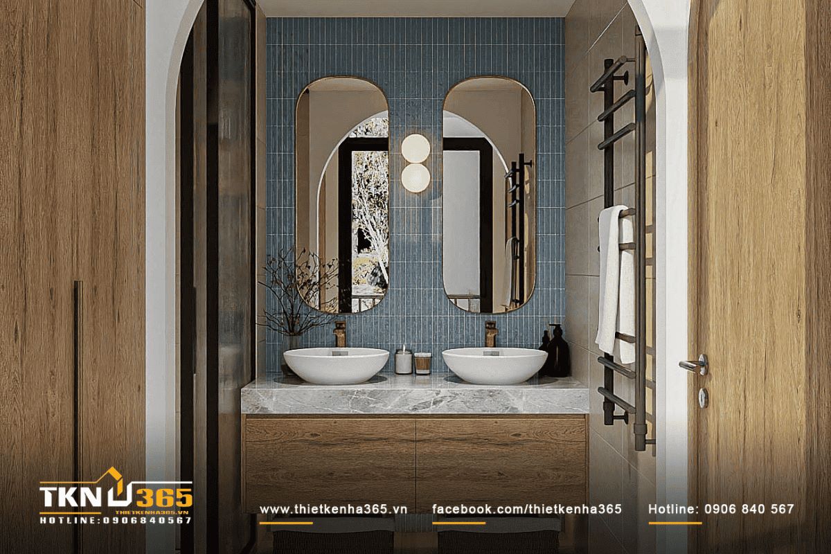 Gương oval lớn c&ugrave;ng gạch men m&agrave;u xanh nhạt tạo điểm nhấn độc đ&aacute;o