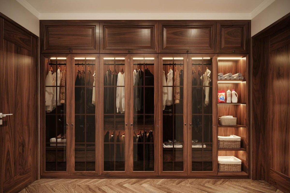 Tủ quần áo kịch trần gỗ óc chó với cánh kính sang trọng, kết hợp ánh sáng âm tủ tạo không gian lưu trữ đẳng cấp