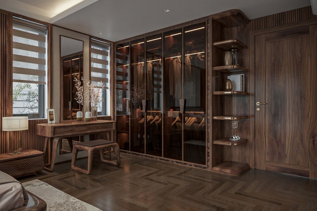 Tủ quần áo kịch trần bằng gỗ óc chó kết hợp cánh kính màu nâu, mang lại vẻ sang trọng và đồng bộ với toàn bộ không gian phòng ngủ