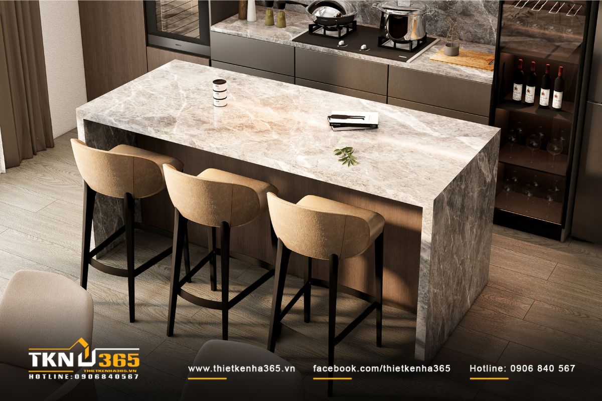 Đảo bếp ốp đá vân mây là khu vực chuẩn bị món ăn, đồng thời là bàn bar tiện dụng kết nối không gian