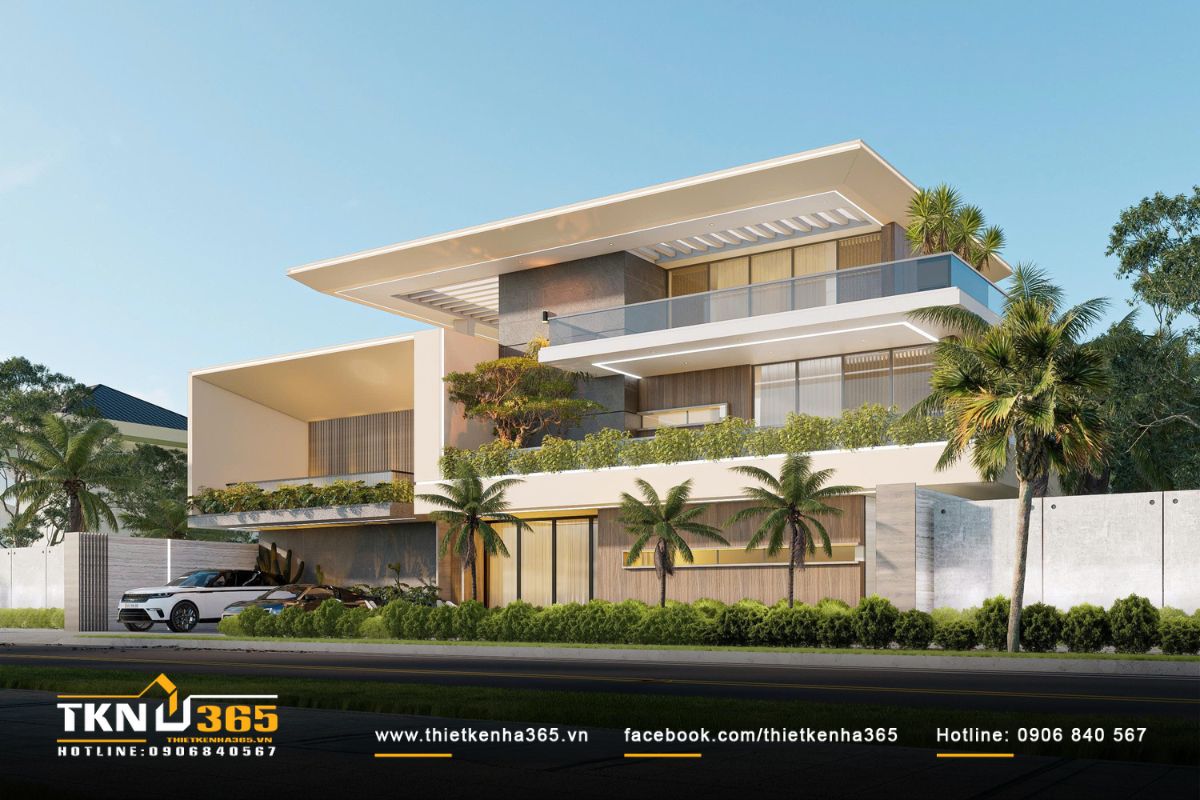 Khu vực sân trước bố trí cây lớn và xương rồng cảnh quan, làm dịu hơi nóng từ mặt đường