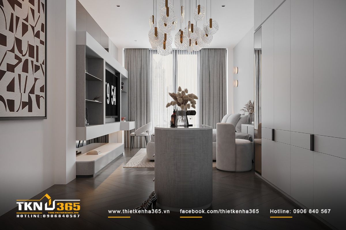 Bàn đảo hình bầu dục đặt ở trung tâm phòng, đây là điểm nhấn trang trí, đồng thời hỗ trợ gia chủ thay đồ và thử phụ kiện tiện lợi