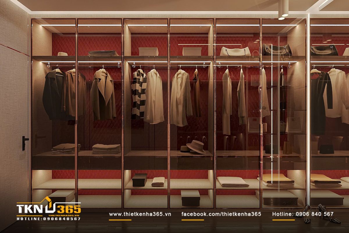 Không gian thay đồ bố trí trong phòng ngủ, hệ tủ kính trong suốt phông nền đỏ rượu vang gợi cảm giác sang trọng