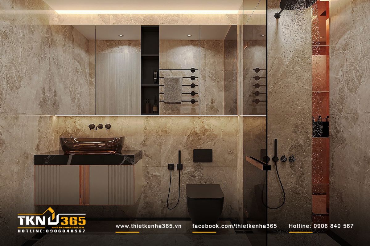 Phòng tắm ốp đá marble vân nâu, lavabo đặt trên bệ đá đen sang trọng, vững chãi
