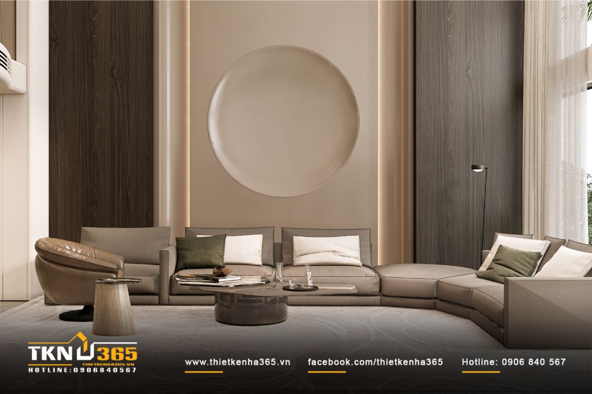 Phòng khách biệt thự 3 tầng gây ấn tượng với mảng tường tạo hình tròn, ánh sáng hắt khe dịu nhẹ gợi bầu không khí trang nhã, tinh tế