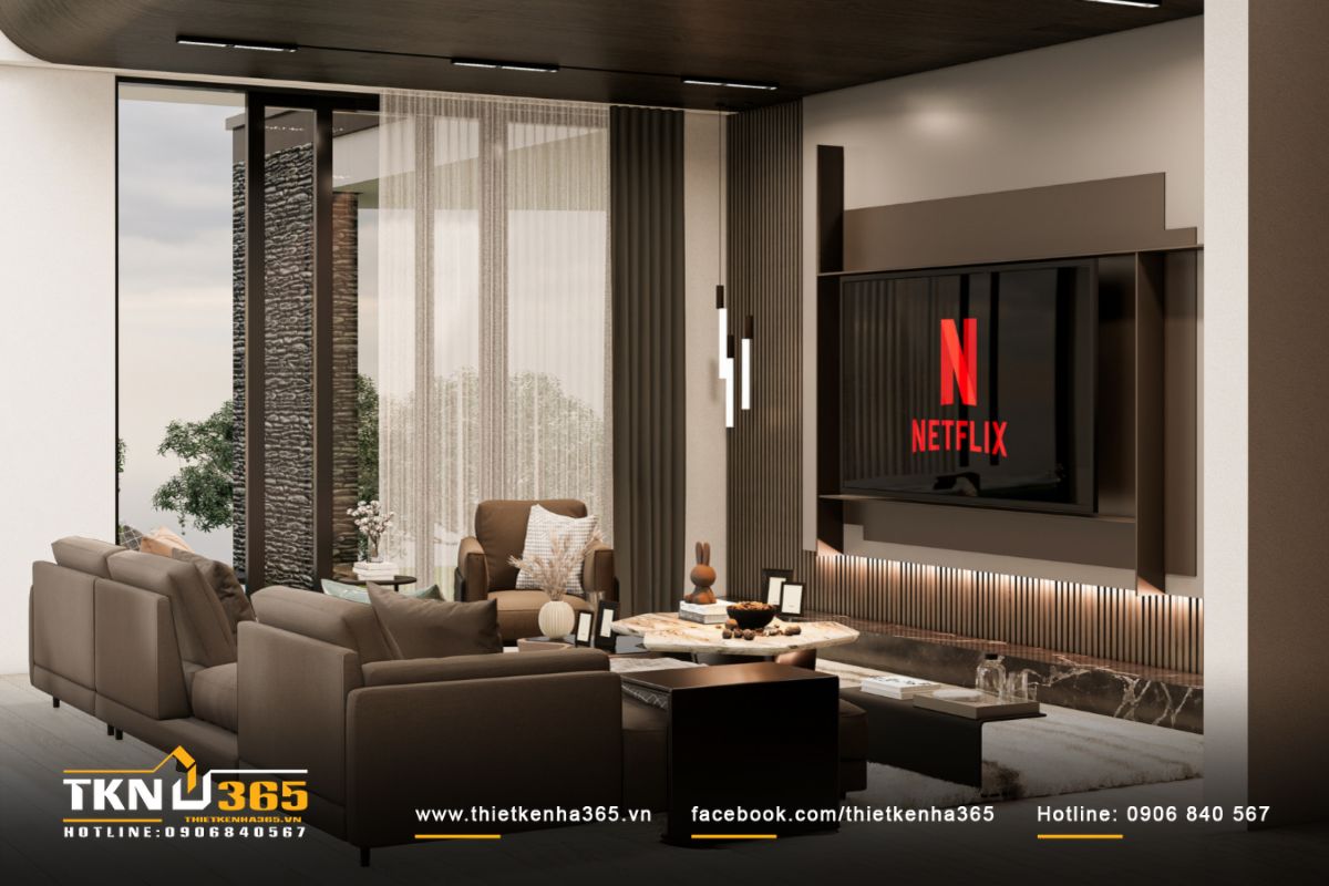 Trần ốp gỗ bo cong nhẹ giúp chuyển tiếp mượt mà giữa phòng khách và không gian liền kề, gợi cảm giác thân thuộc