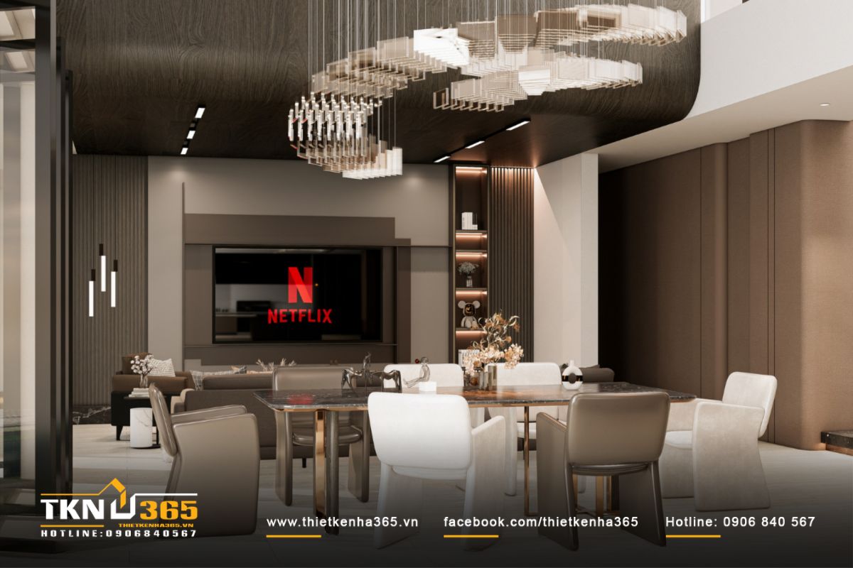 Bàn ăn đặt giữa trung tâm, đèn thả pha lê uốn lượn như điểm nhấn nghệ thuật kết nối trần và sàn