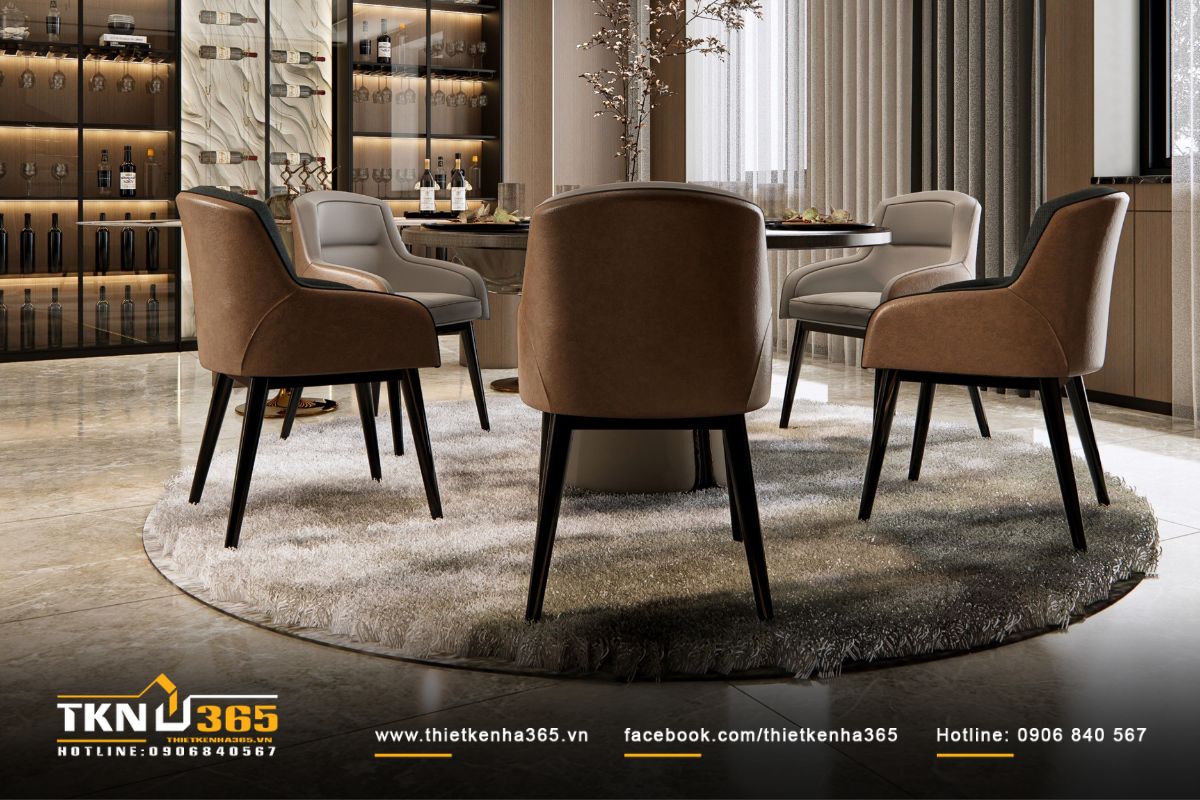 Không gian ăn uống sang trọng, bàn tròn đặt giữa thảm lông dày, ghế da màu nâu sữa gợi cảm giác ấm cúng và gần gũi