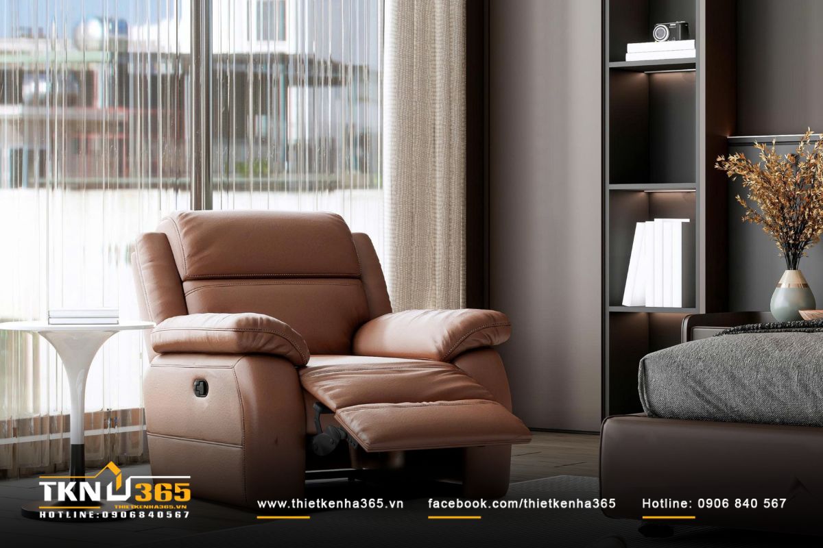 Ghế lounge da nâu đặt cạnh khung cửa kính lớn, đây là góc thư giãn lý tưởng để gia chủ ngắm cảnh và đọc sách