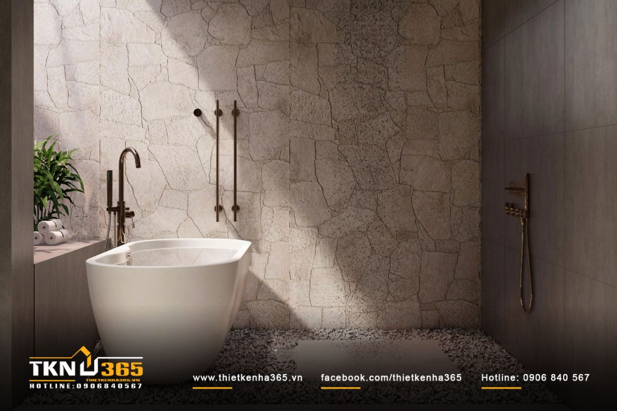 Bồn tắm đứng đặt riêng, bao quanh là tường đá thô mộc tạo cảm giác thư giãn như spa tại gia