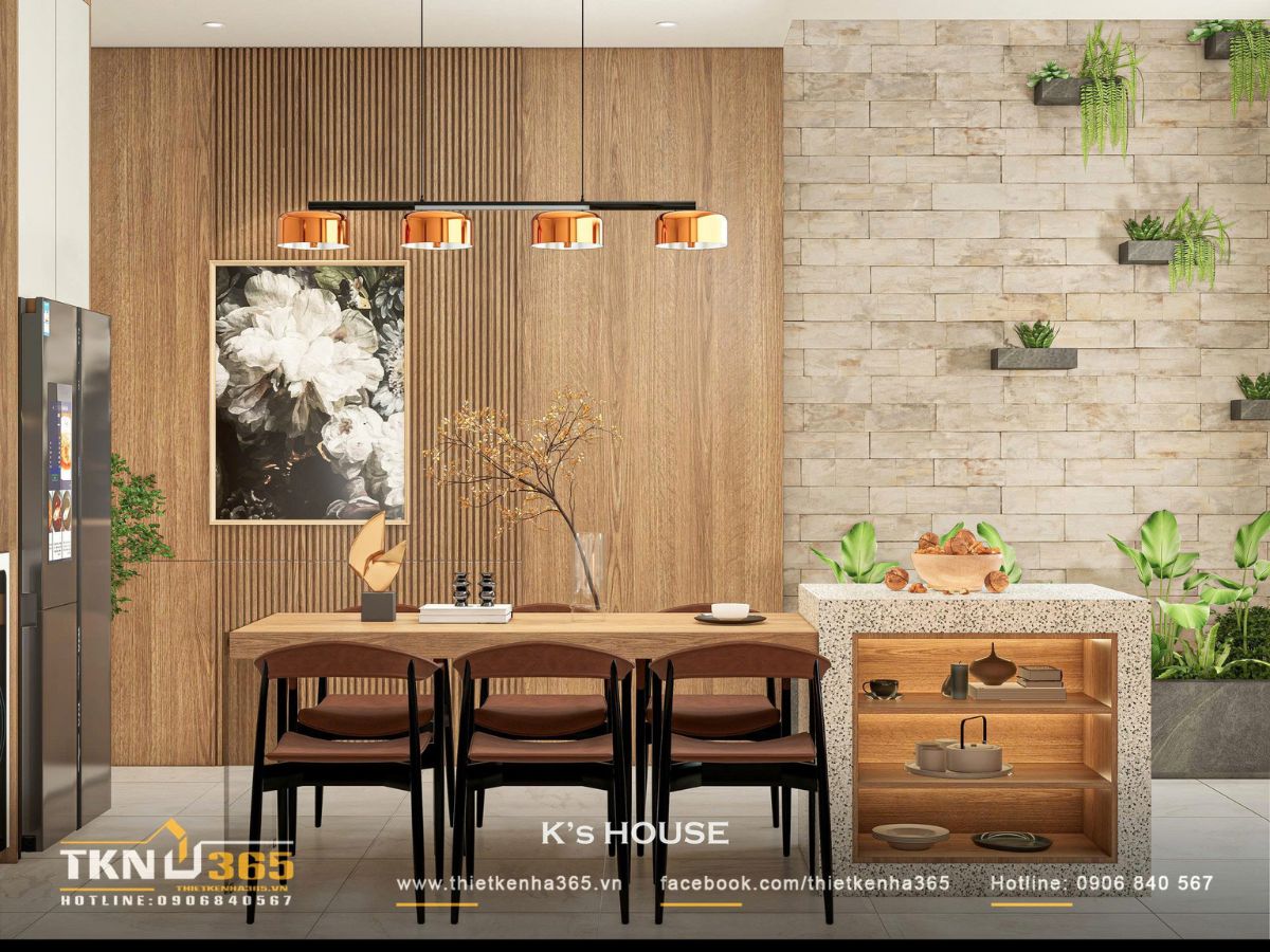 Mảng tường ốp gỗ và đá thô mộc kết hợp cây xanh, mang lại cảm giác tự nhiên và tinh thần Wabi Sabi cho không gian