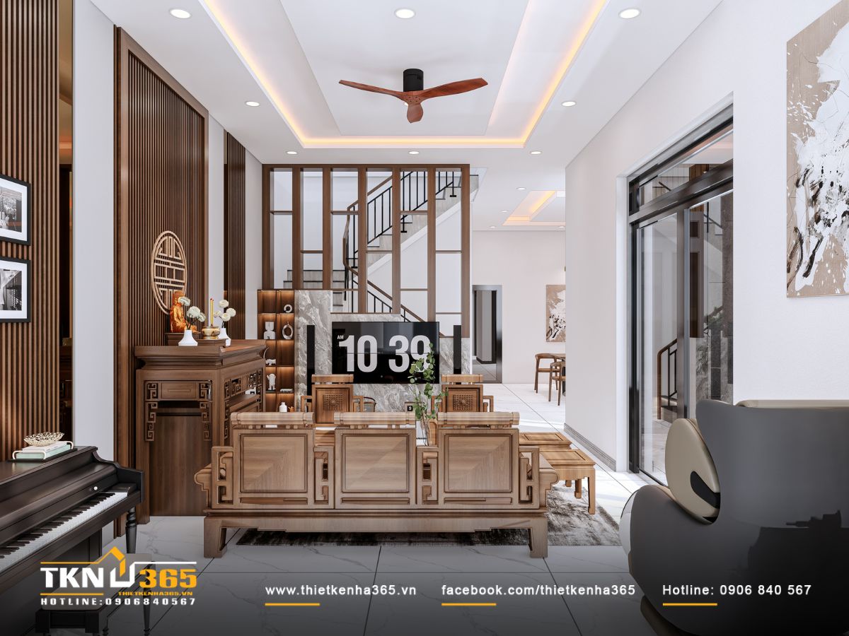 Lam gỗ và bức tường đá sau tivi tạo chiều sâu thị giác, kết hợp ánh sáng hắt trần cho không gian sinh hoạt chung thêm ấm áp