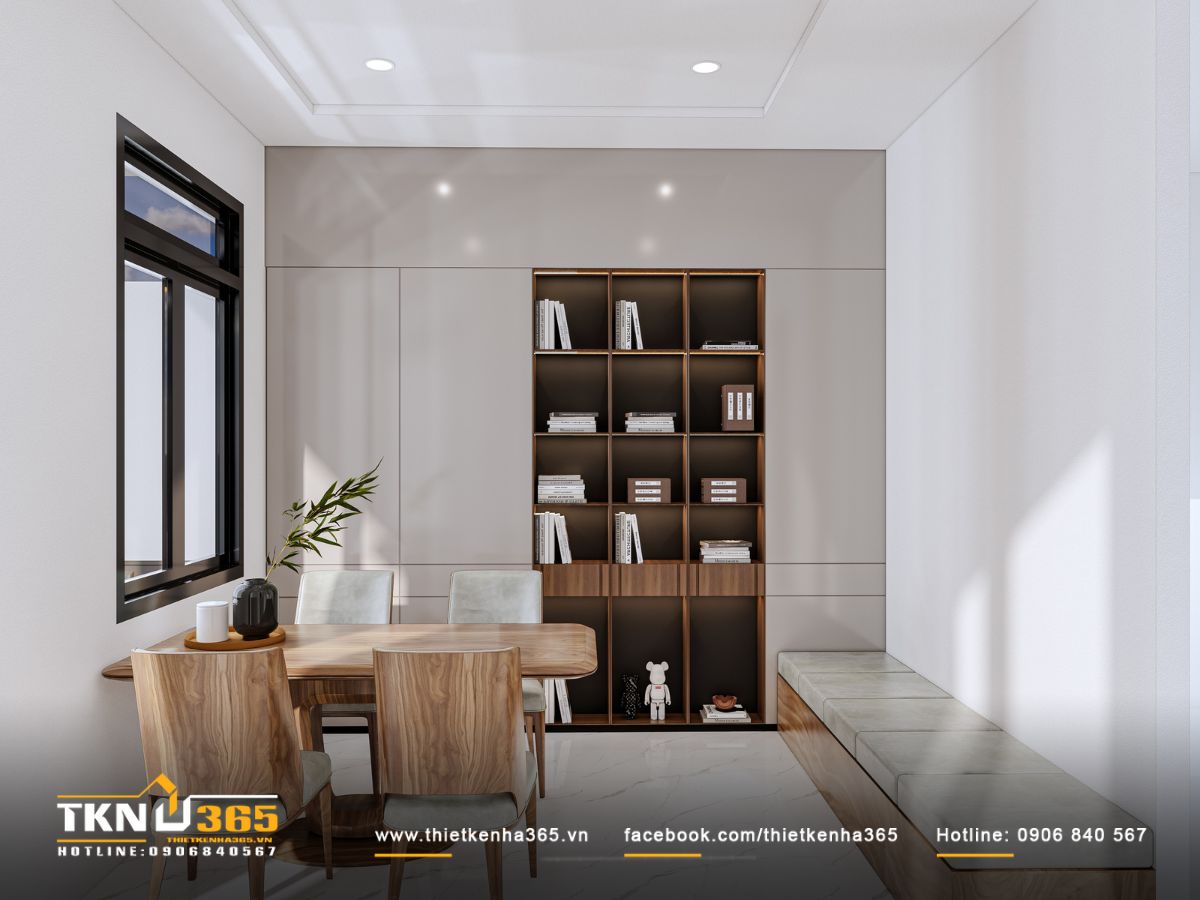 Góc đọc sách đón sáng tự nhiên từ cửa sổ lớn, tạo bầu không khí yên tĩnh và thoáng đãng