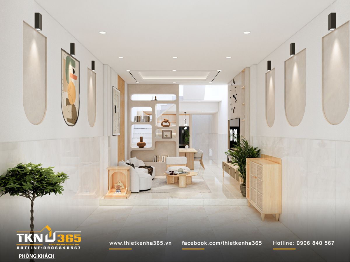 Phòng khách thoáng sáng nhờ trần cao và tường trắng, tạo nền cho những mảng ốp đá sáng màu đầy tinh tế