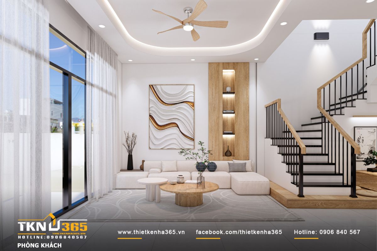 Phòng khách thoáng sáng với sofa chữ L và mảng tường trang trí bằng tranh vẽ mềm mại và kệ gỗ kịch trần