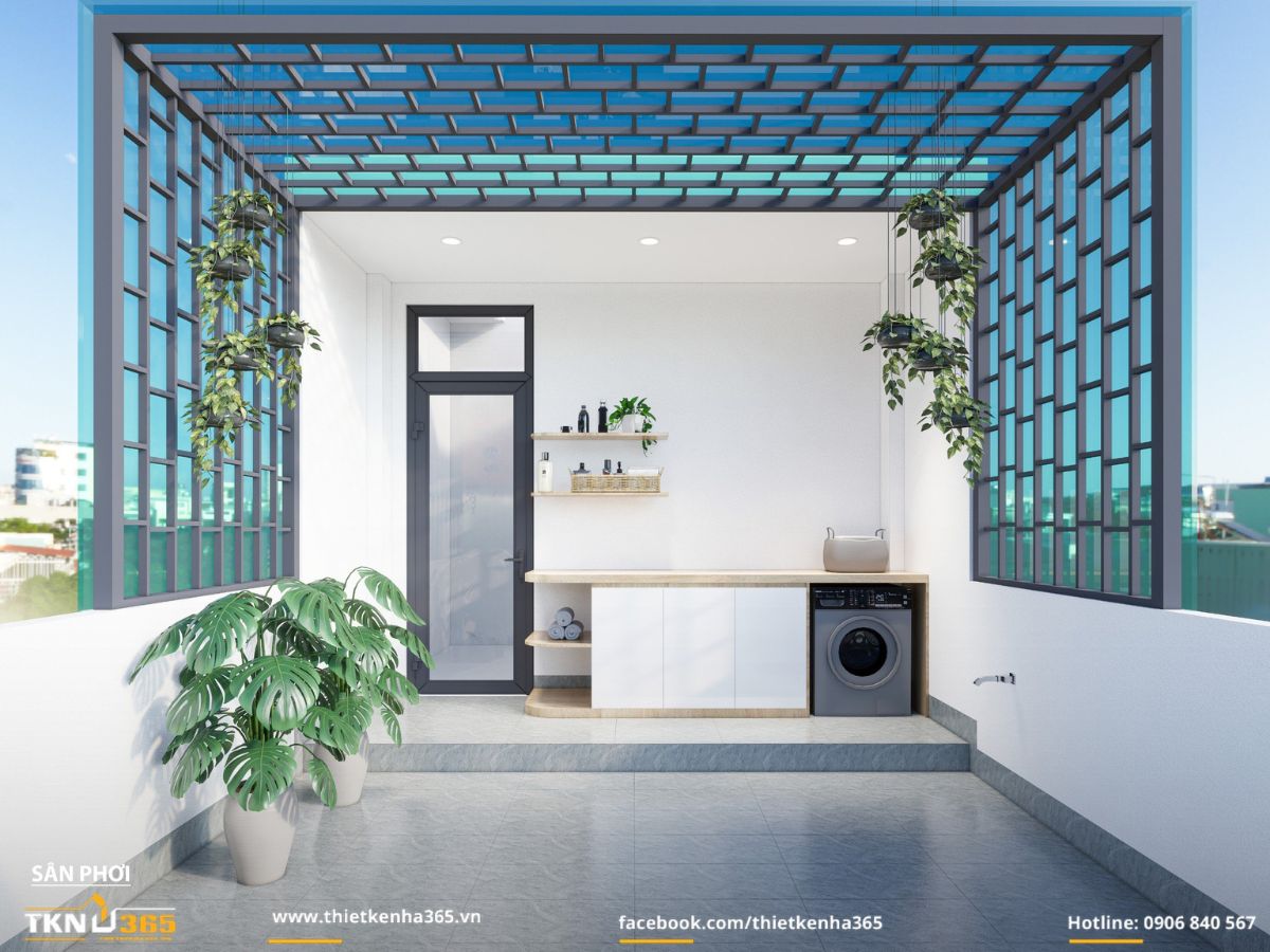 Sân phơi thoáng mở với khung thép và mái kính xanh lọc nắng, tủ tích hợp máy giặt - bồn rửa gọn gàng, điểm xuyết cây xanh mang lại cảm giác gần gũi thiên nhiên