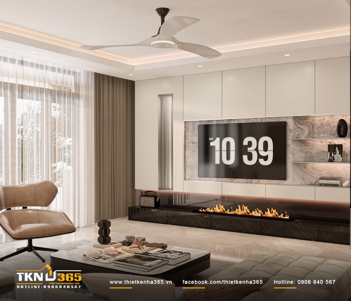 Mảng tường tivi xử lý như một bức phù điêu, kết hợp tấm ốp phẳng màu kem và đá vân mây đặt lệch trục