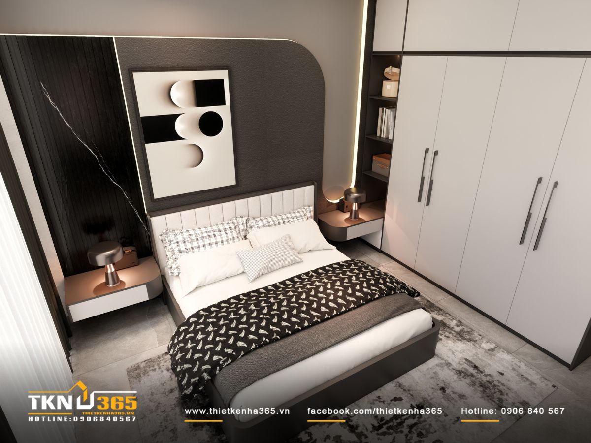 Góc nhìn từ trên xuống cho thấy bố cục “ít nhưng đủ” với giường, tủ quần áo, tủ đầu giường và đèn ngủ bố trí cân đối