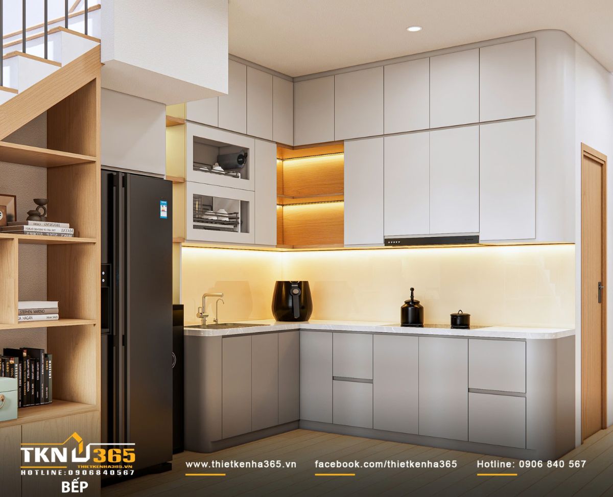 Bếp và tủ lưu trữ được bố trí liền mạch, giữ cho không gian luôn sáng và sạch