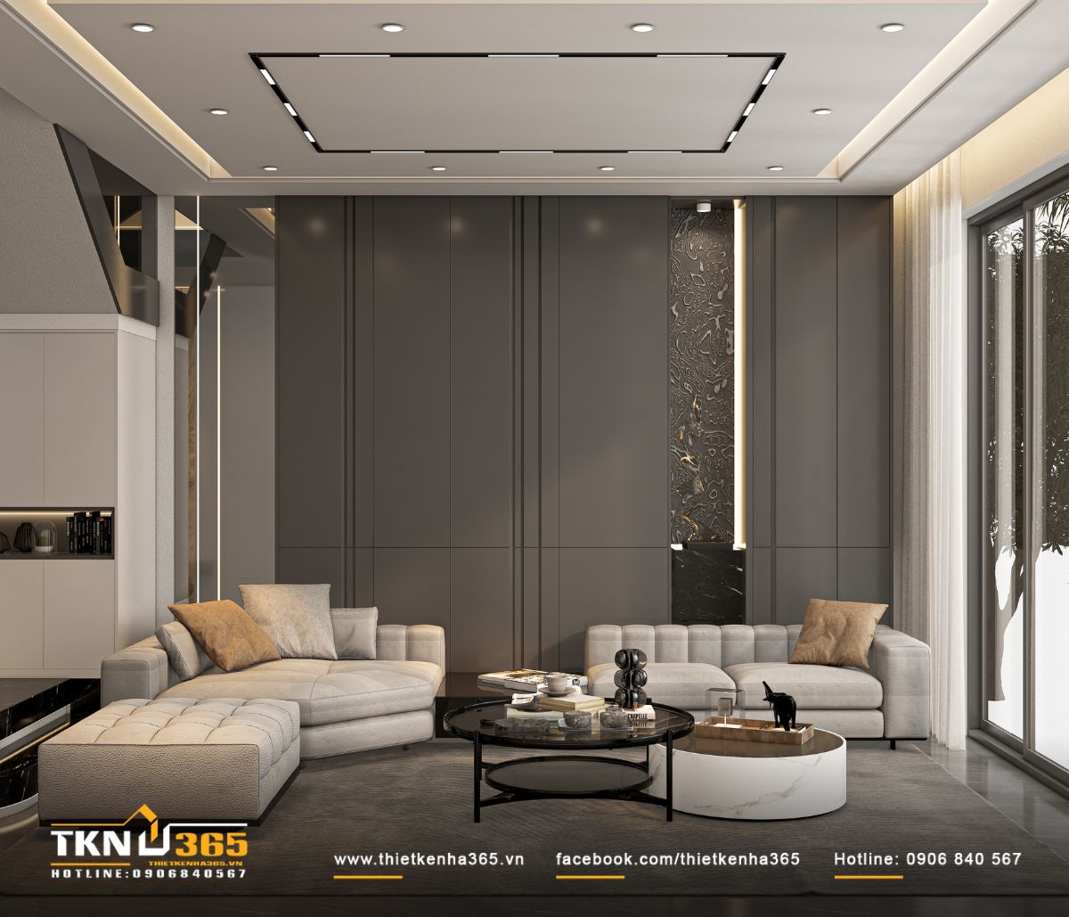 Bộ sofa màu xám - kem đường nét mềm mại là điểm nhấn trung tâm của không gian phòng khách