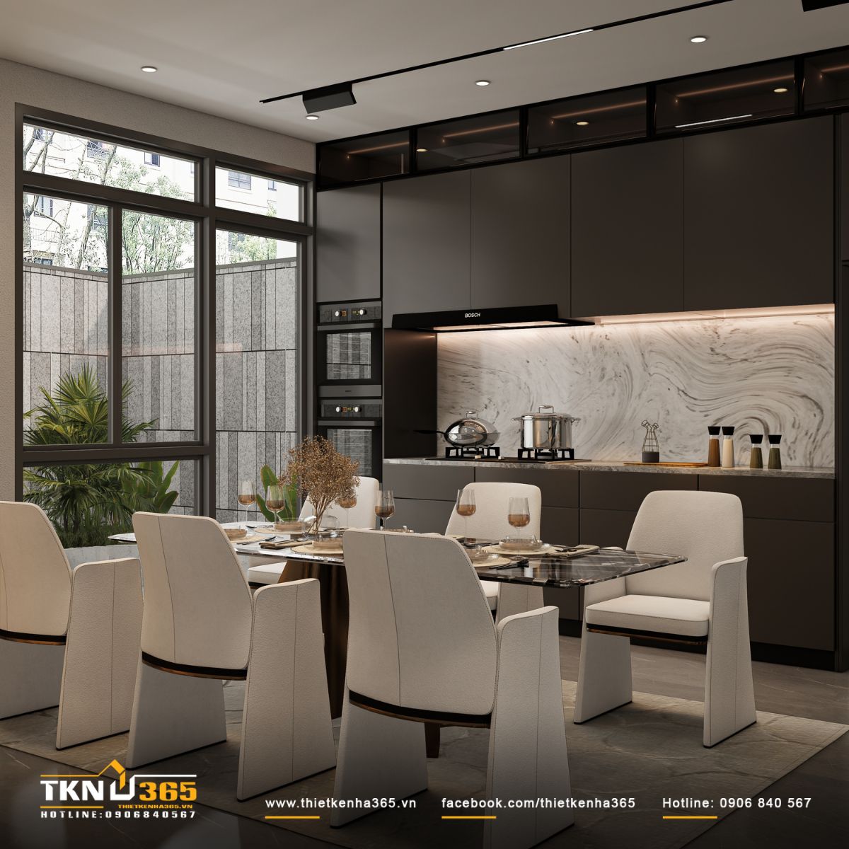 Cửa kính lớn đưa ánh sáng tự nhiên vào bếp - ăn, giúp không gian luôn thoáng sáng và kết nối với mảng xanh bên ngoài