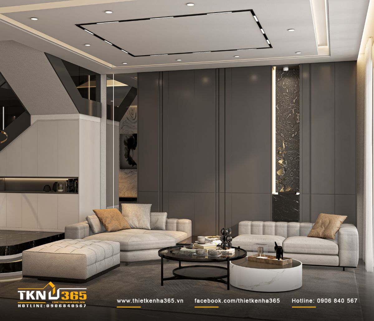 Bức tường xám phẳng tối giản, đóng vai trò phông nền cho toàn bộ phòng khách, giúp bố cục trở nên mạch lạc và sang trọng