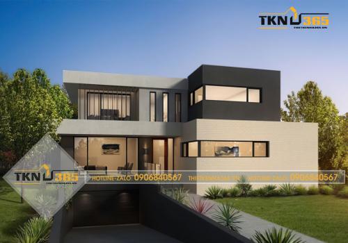 Một ngôi nhà biệt thự nghỉ dưỡng với tầng hầm để xe giữa khu vườn cây cỏ xanh mát