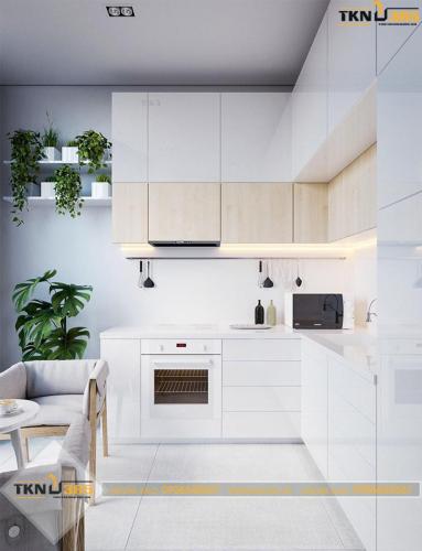 Tủ bếp được thiết kế hình chữ L trắng sáng, sạch sẽ