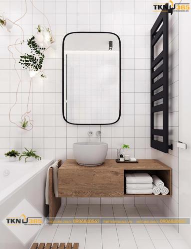 Phòng tắm được thiết kế tối giản với tông màu trắng làm chủ đạo