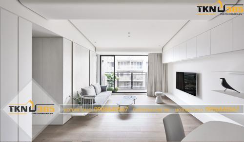 Phòng khách được thiết kế theo kiểu tối giản với tone màu trắng làm chủ đạo