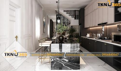 Phòng bếp kết hợp với phòng ăn có tủ bếp được thiết kế kịch trần, bàn đá sáng bóng